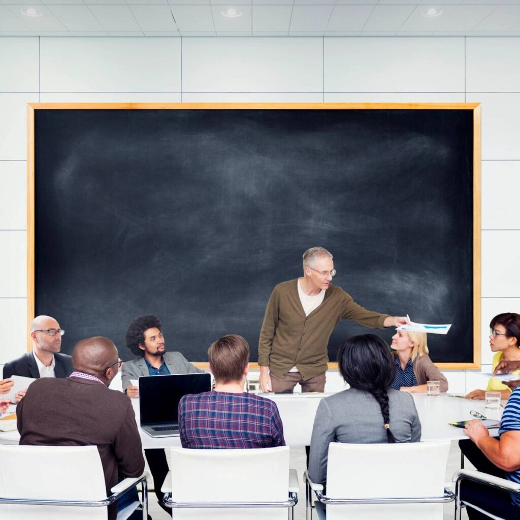 A group of people sitting around a table.